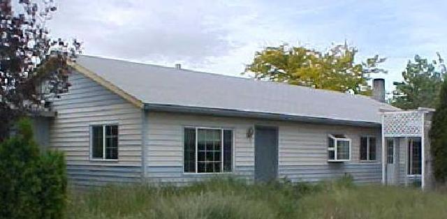 2291 St Hilaire Road Moxee, WA 98936 - Photo 1 of 5 a view of a house with a yard