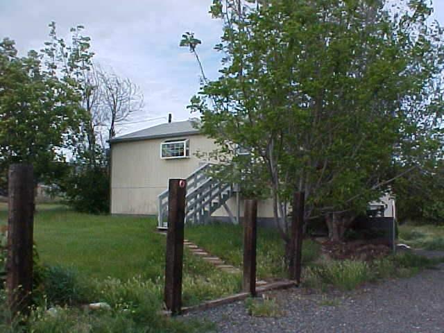 2291 St Hilaire Road Moxee, WA 98936 - Photo 3 of 5 a view of a house with backyard