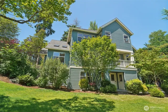 a aerial view of a house with a garden and trees