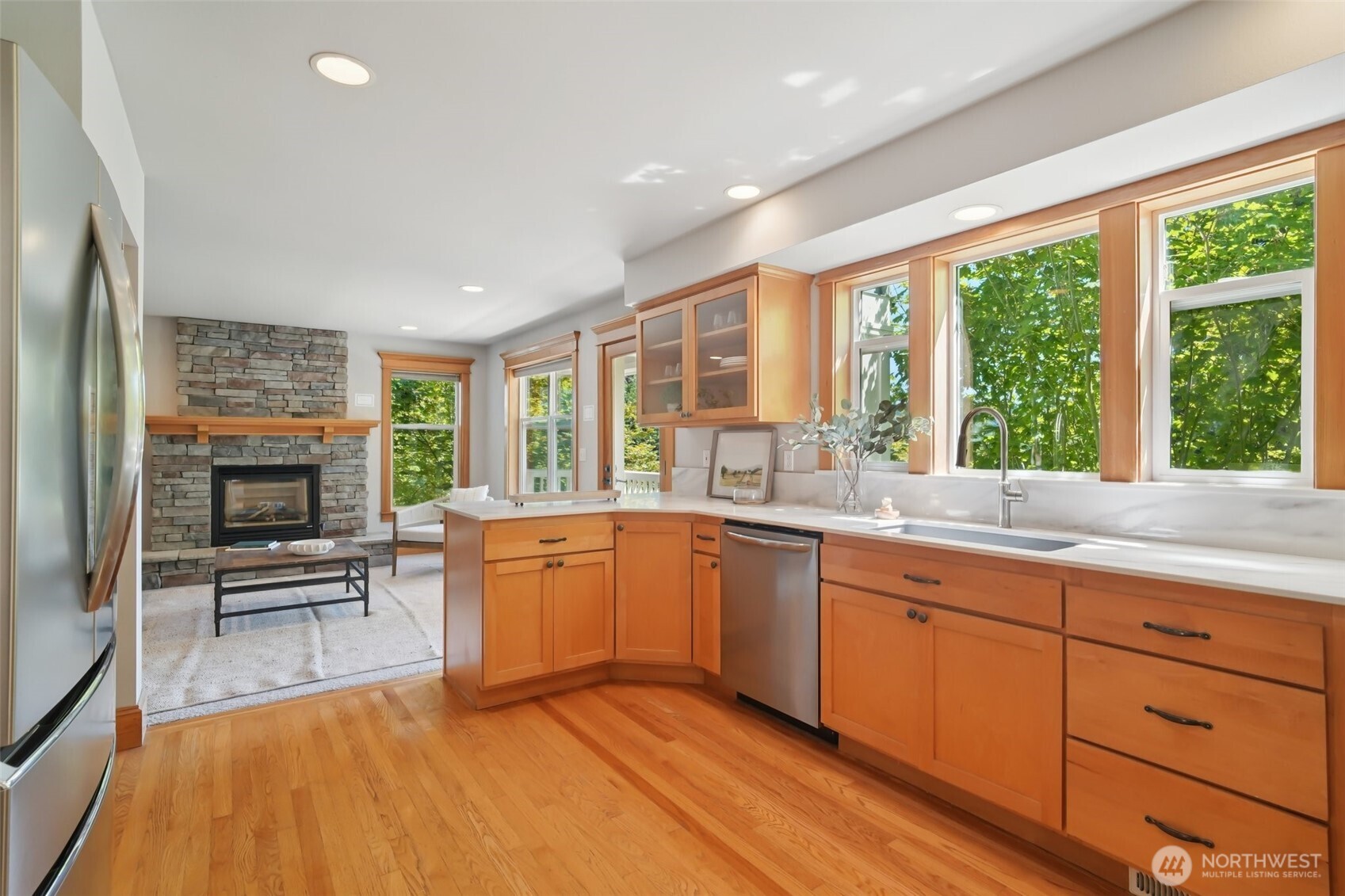 23623 20th Avenue West Bothell, WA 98021 - Photo 10 of 40 a large kitchen with granite countertop a stove a sink and a dining table view