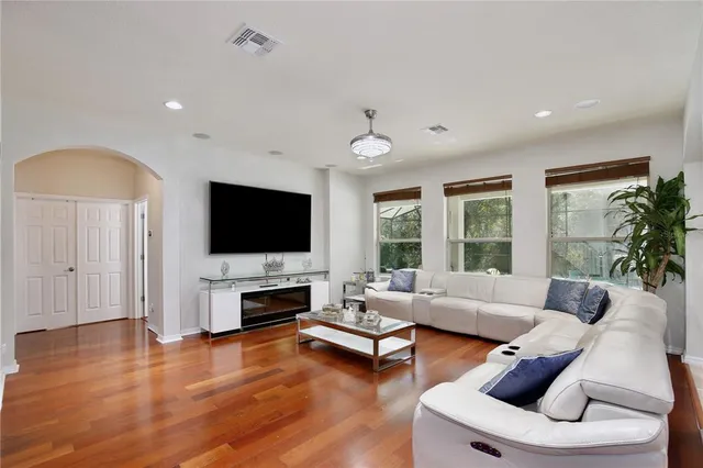 a living room with furniture and a large window