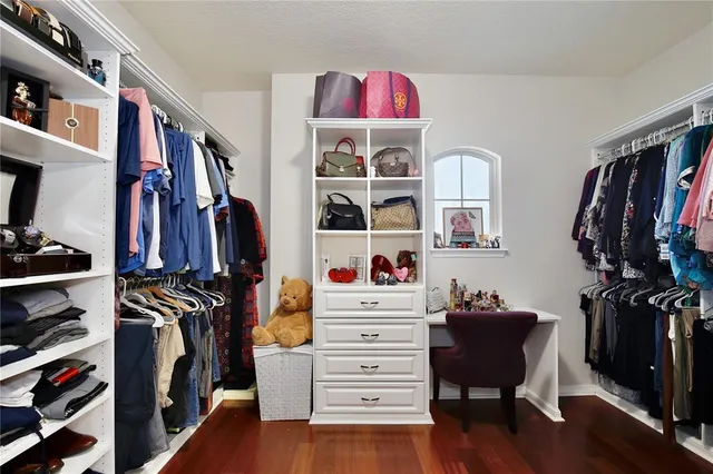 a bedroom with a workspace