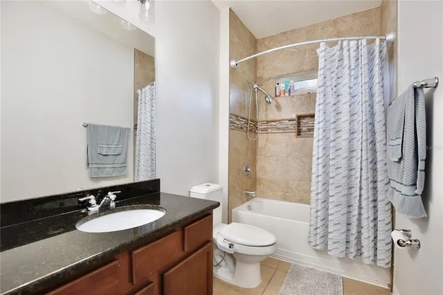 a bedroom with a bed and a book shelf