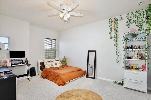 a view of a patio with table and chairs and potted plants