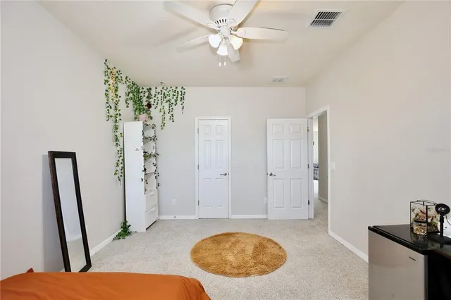 a view of a house with backyard and porch
