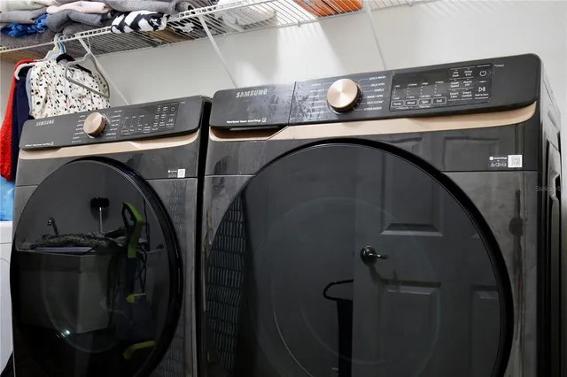 an aerial view of a house with garden space and street view
