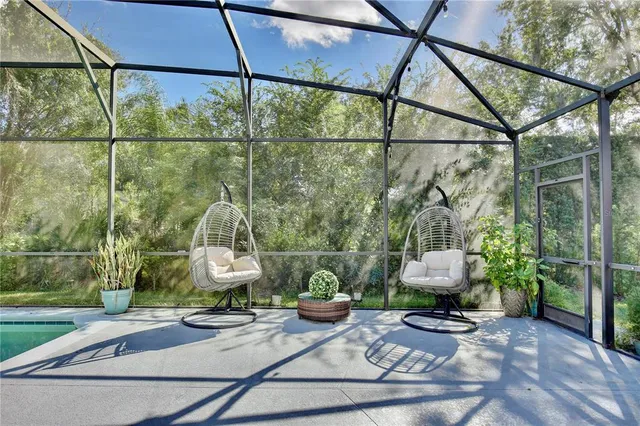 an aerial view of a house with a garden and lake view