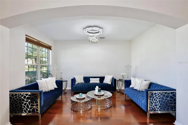 a living room with furniture and a window