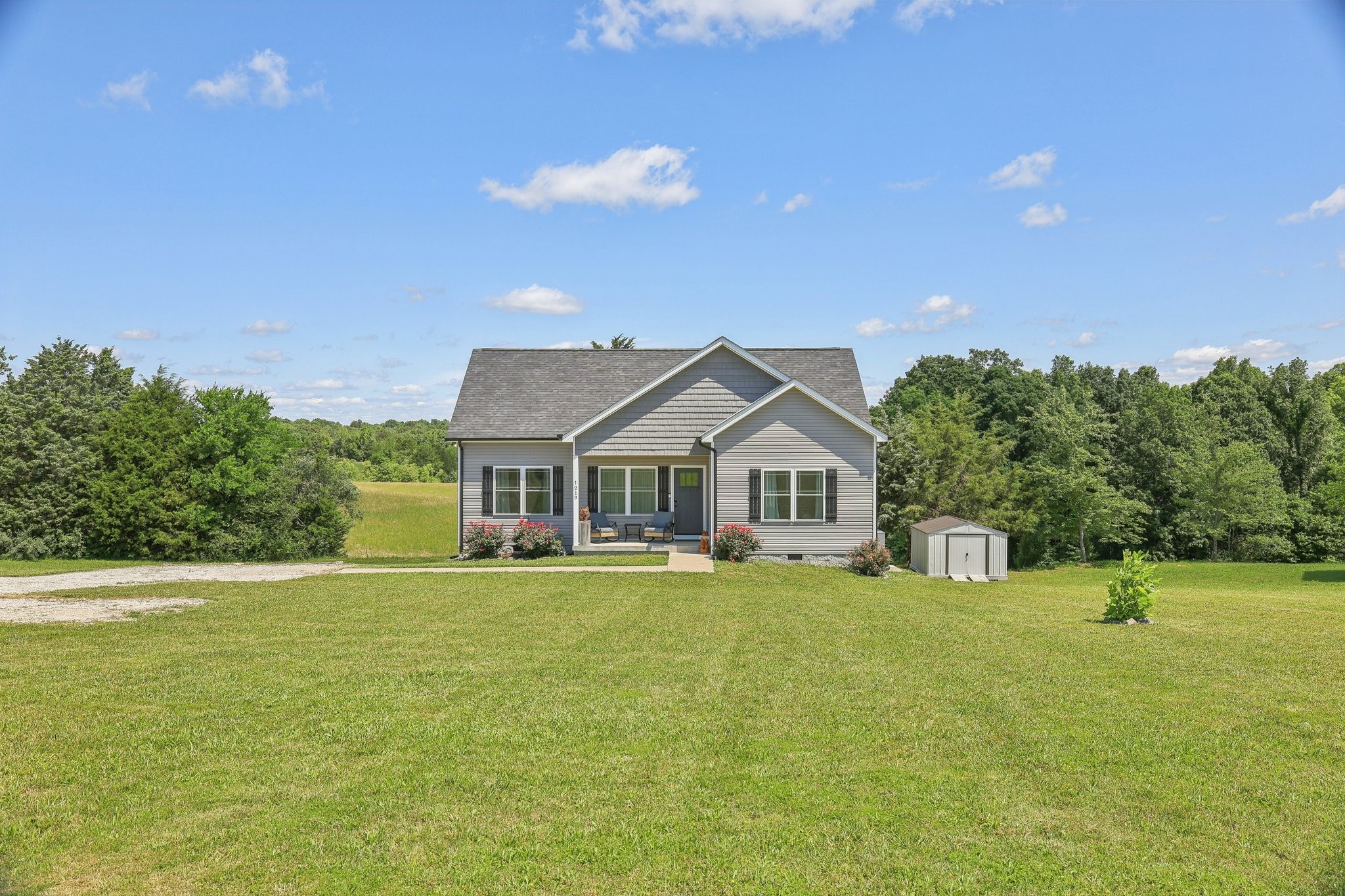 1219 Oak Grove Road Dickson, TN 37055 - Photo 1 of 52 a front view of a house with a yard
