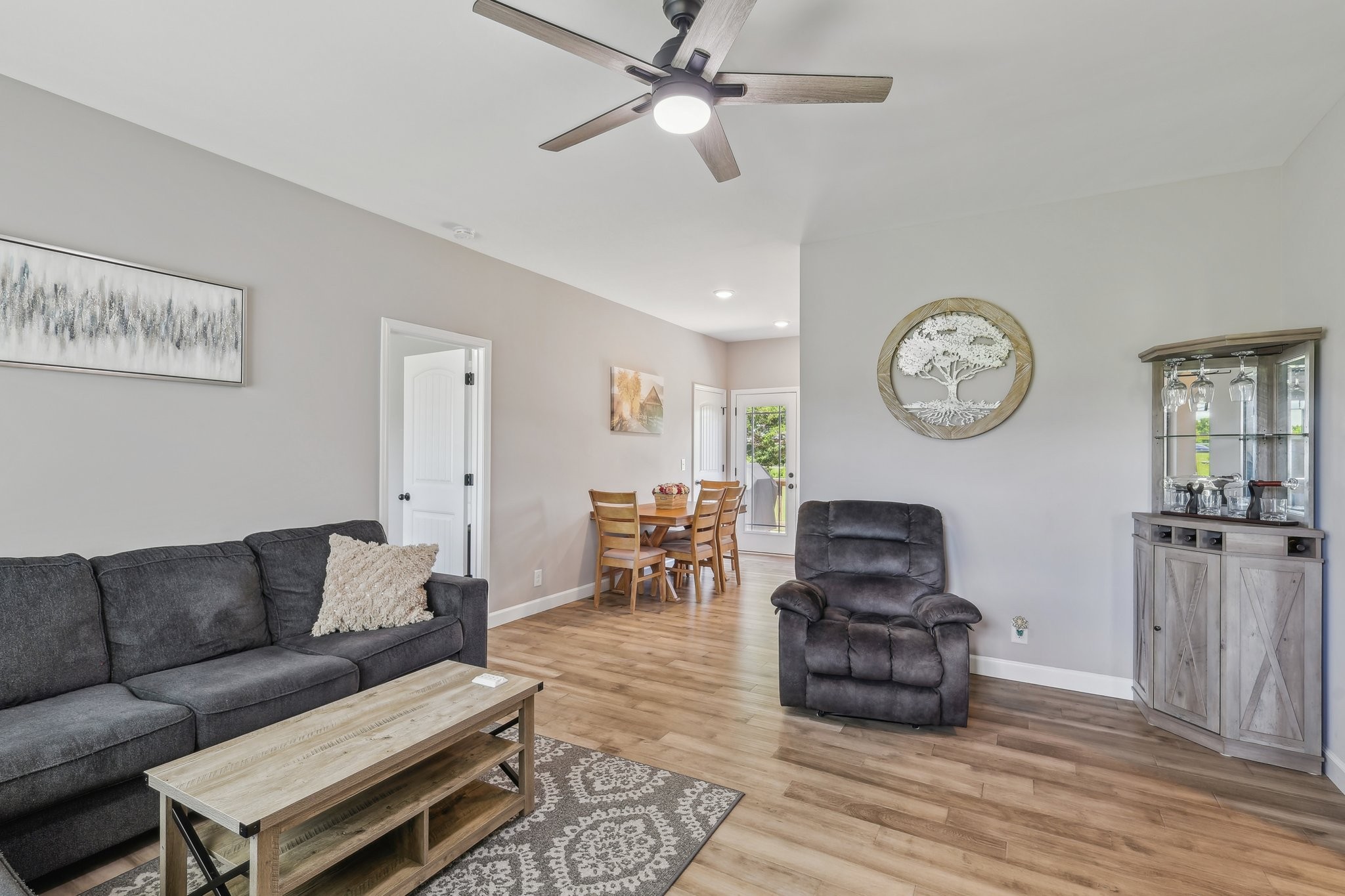 1219 Oak Grove Road Dickson, TN 37055 - Photo 13 of 52 a living room with furniture a clock on wall and a window