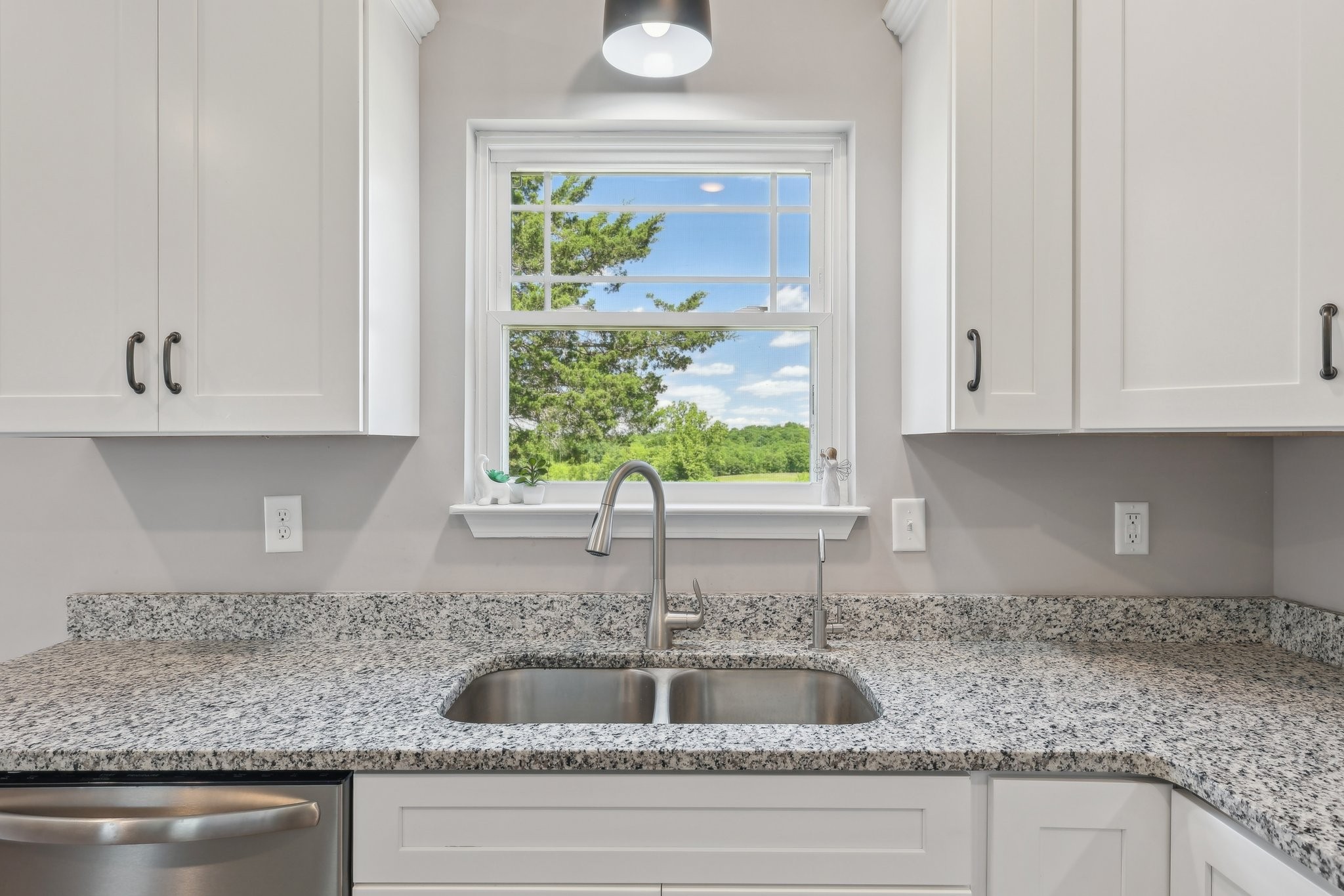 1219 Oak Grove Road Dickson, TN 37055 - Photo 15 of 52 a kitchen with granite countertop a sink and cabinets