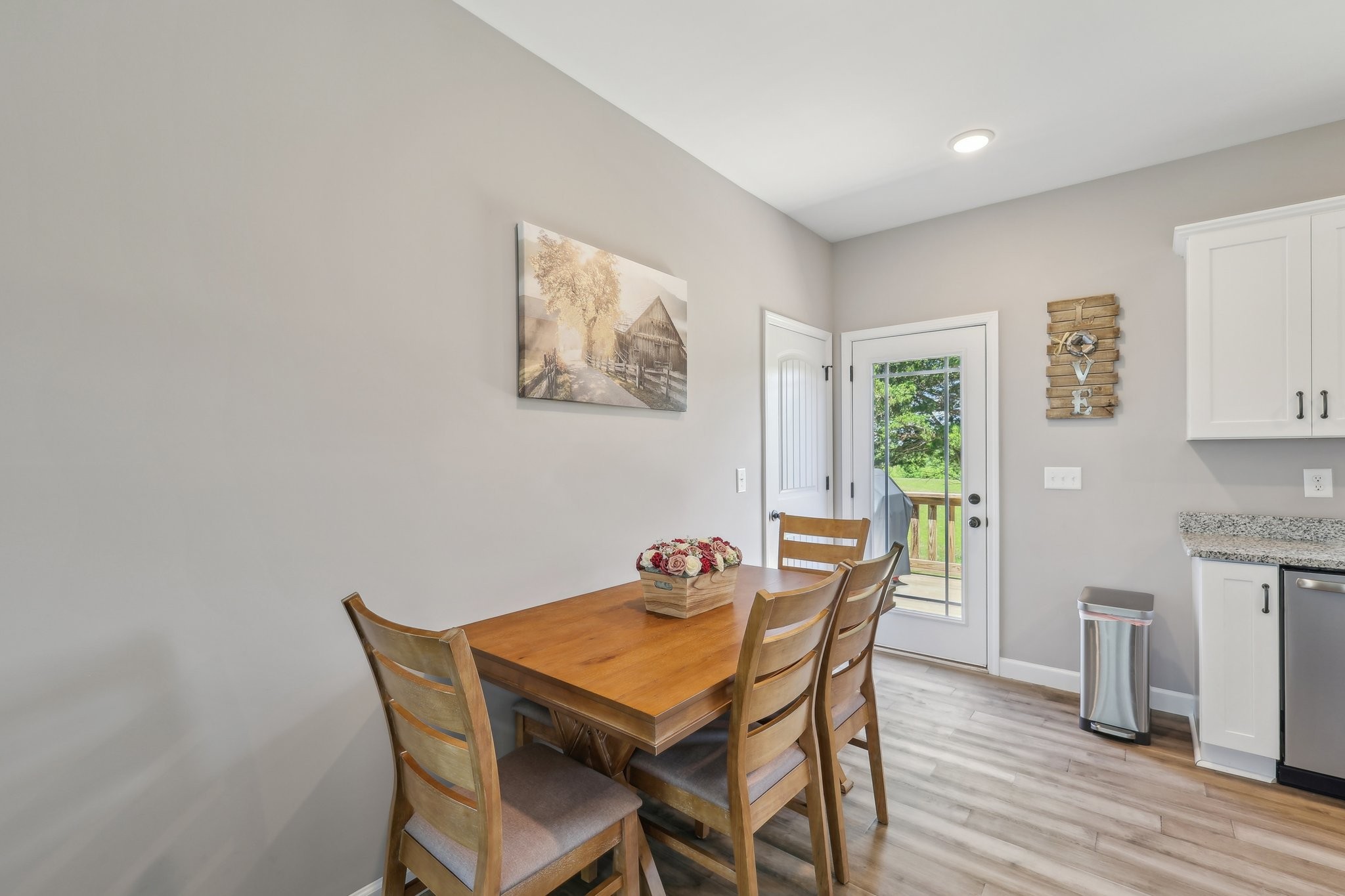 1219 Oak Grove Road Dickson, TN 37055 - Photo 17 of 52 a view of a dining room with furniture and wooden floor