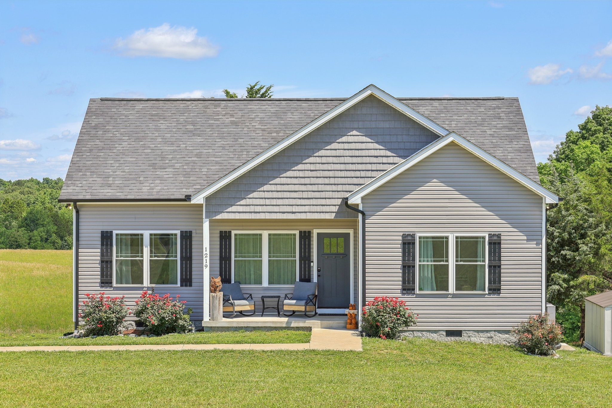 1219 Oak Grove Road Dickson, TN 37055 - Photo 2 of 52 a front view of a house with a yard and outdoor seating