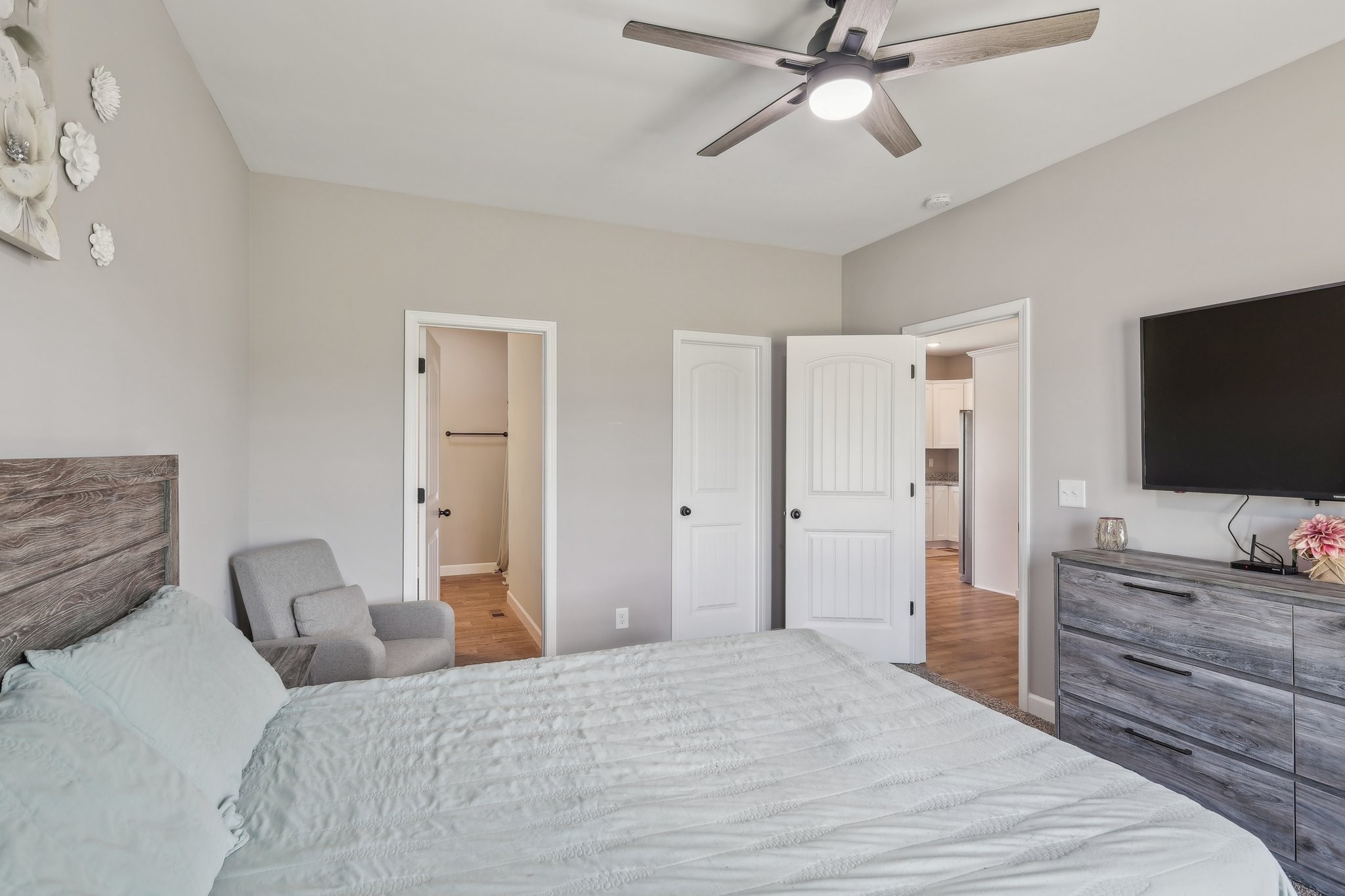 1219 Oak Grove Road Dickson, TN 37055 - Photo 23 of 52 a bedroom with a bed and a flat tv screen on dresser