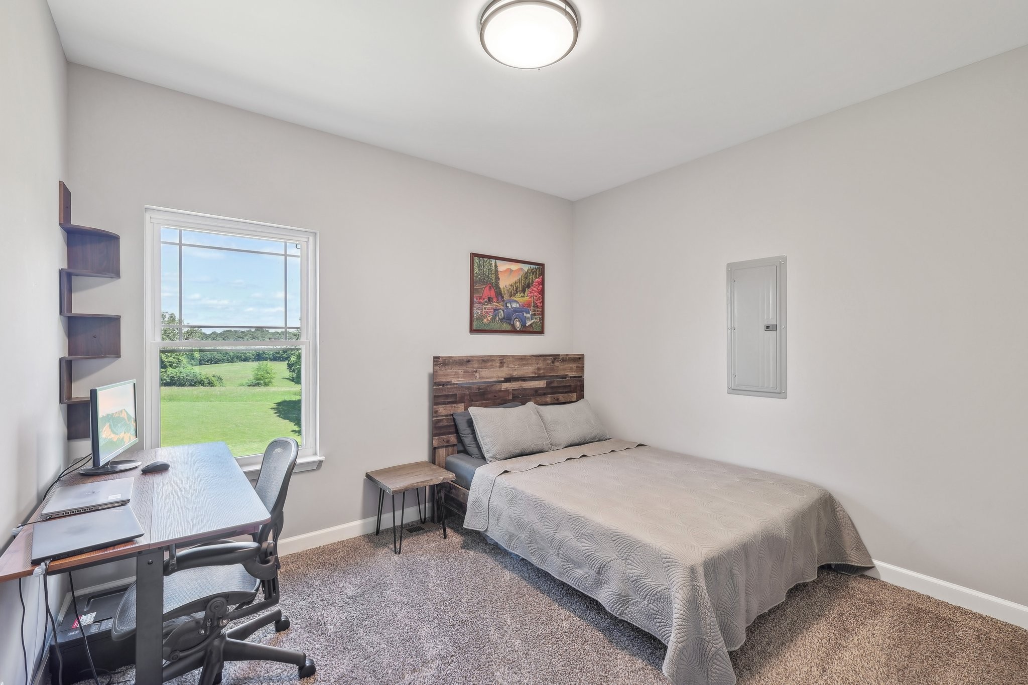 1219 Oak Grove Road Dickson, TN 37055 - Photo 31 of 52 a bedroom with a bed a desk and chair