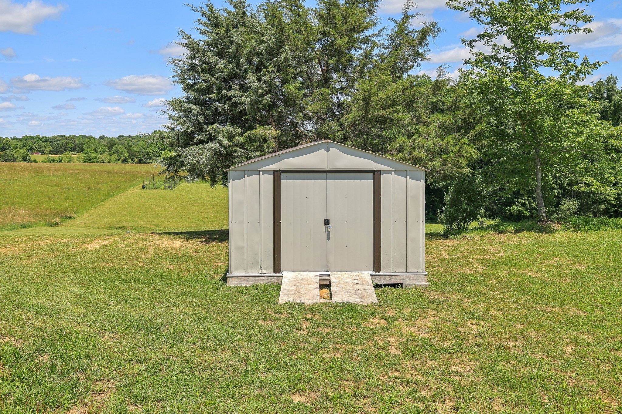 1219 Oak Grove Road Dickson, TN 37055 - Photo 34 of 52 a front view of a house with garden