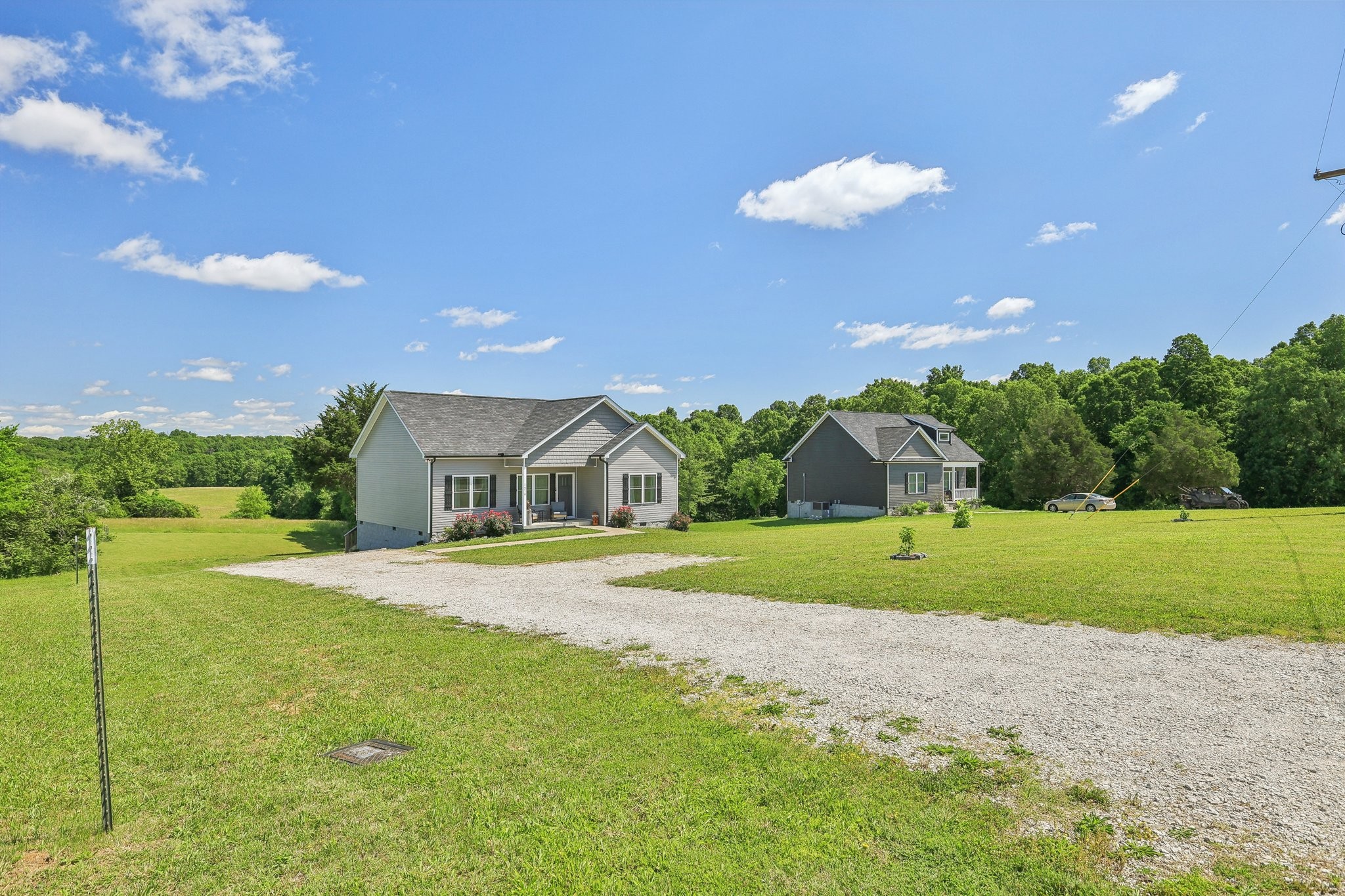 1219 Oak Grove Road Dickson, TN 37055 - Photo 50 of 52 a front view of a house with a yard and garage