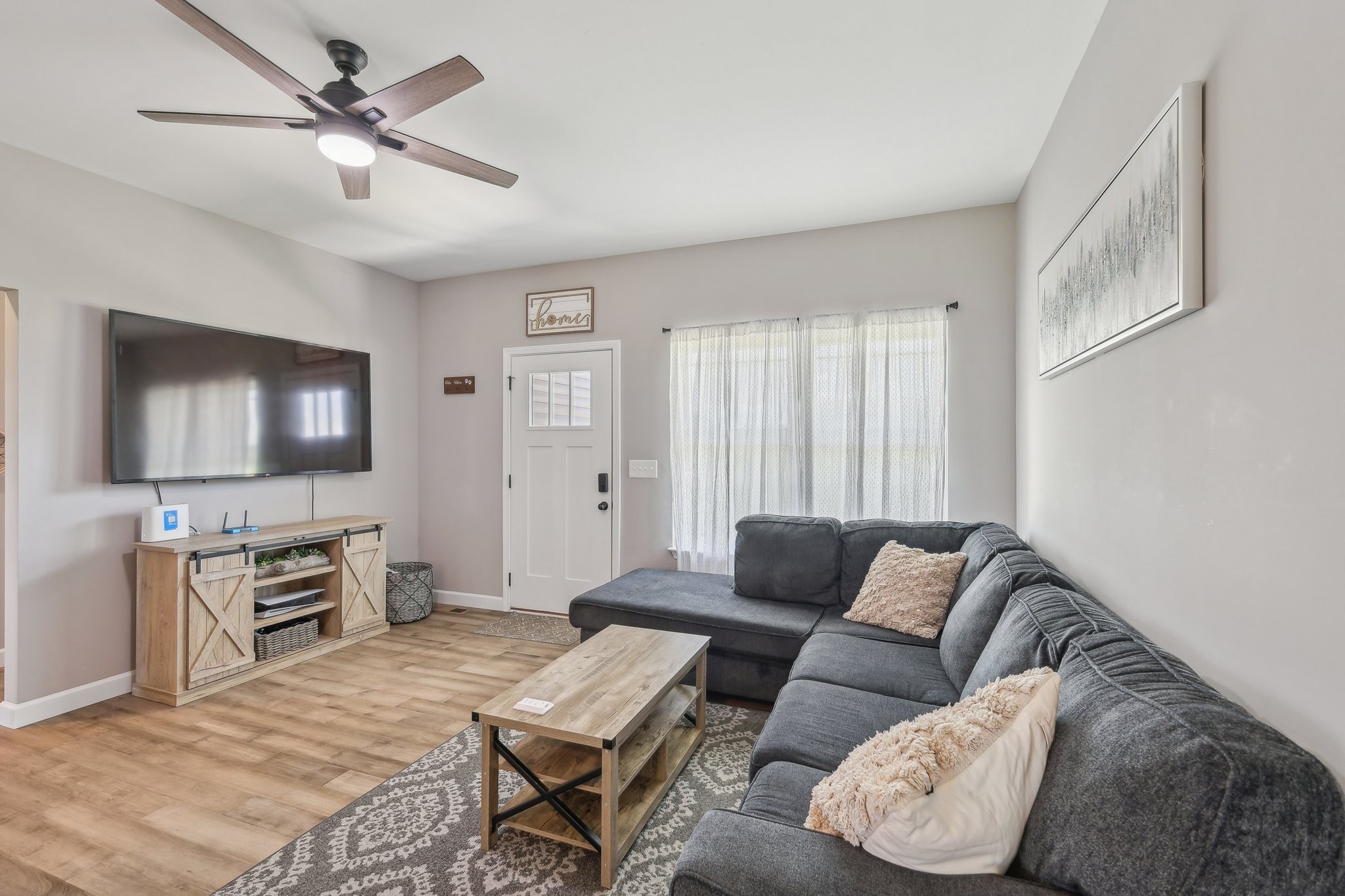 1219 Oak Grove Road Dickson, TN 37055 - Photo 6 of 52 a living room with furniture and a flat screen tv