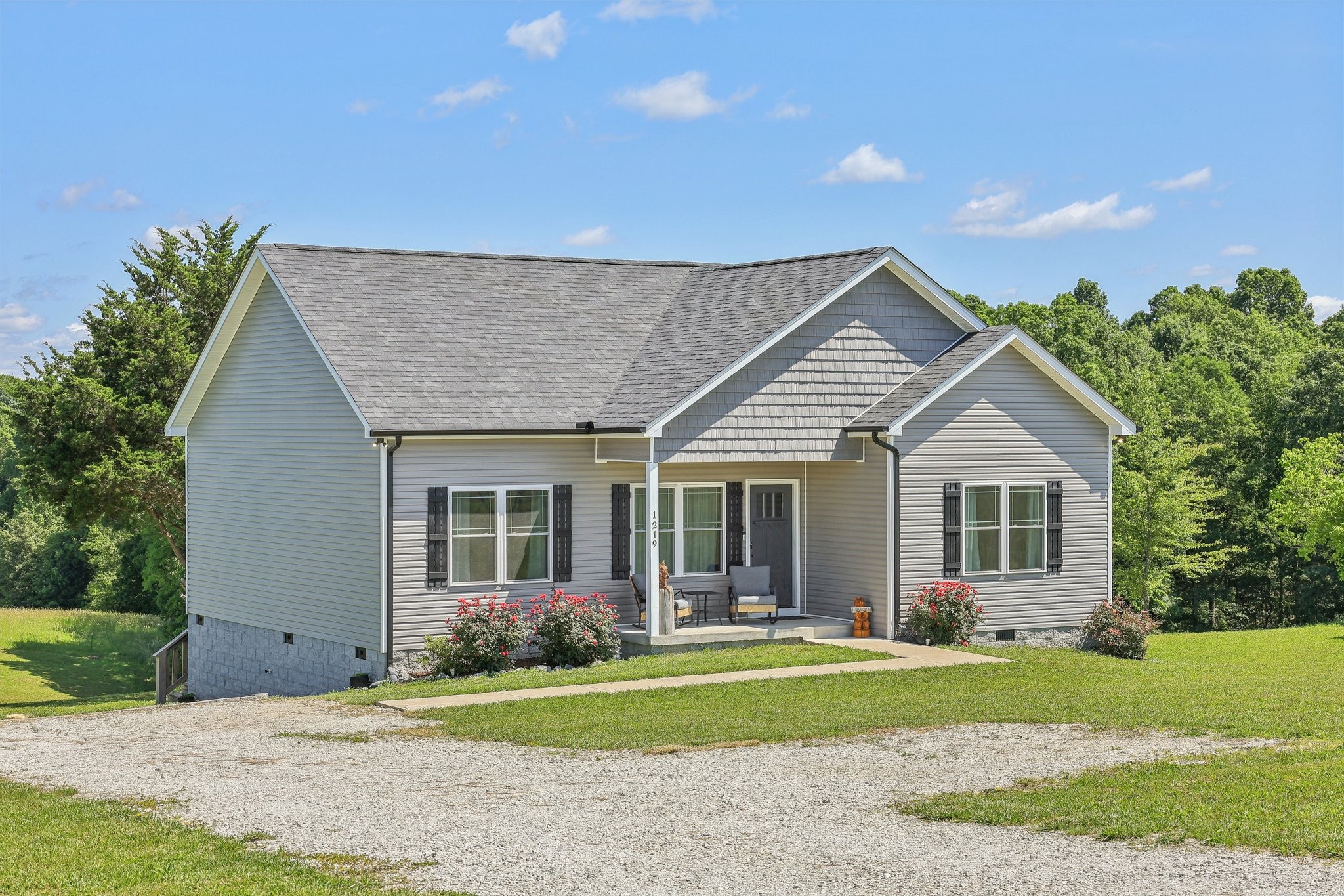 1219 Oak Grove Road Dickson, TN 37055 - Photo 8 of 52 a front view of a house with a yard and porch