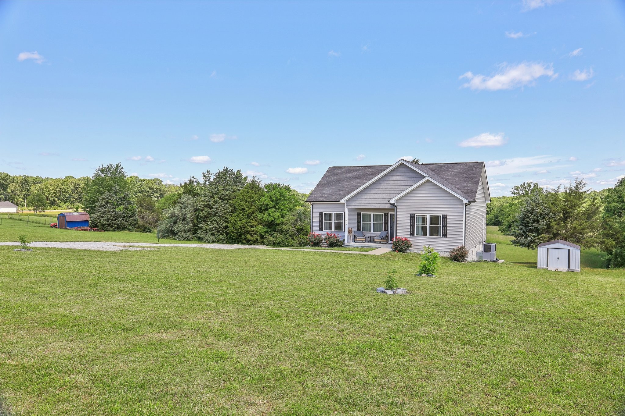 1219 Oak Grove Road Dickson, TN 37055 - Photo 9 of 52 a front view of a house with garden