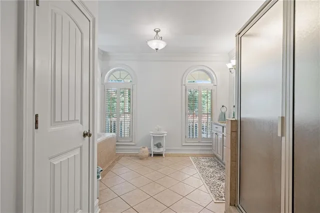a view of a room with large windows and cabinet