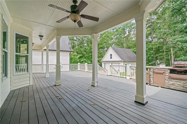 a view of a kitchen with a sink and wooden floor