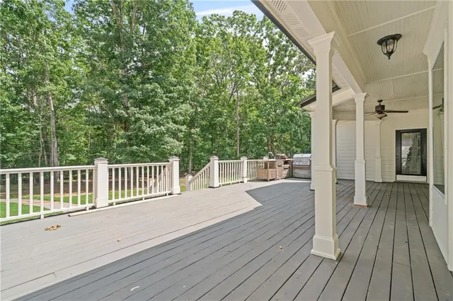 a view of a balcony with wooden floor