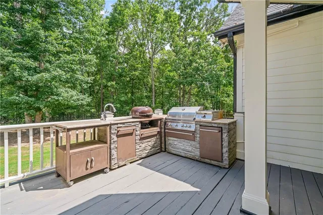 a view of outdoor space with wooden floor and windows