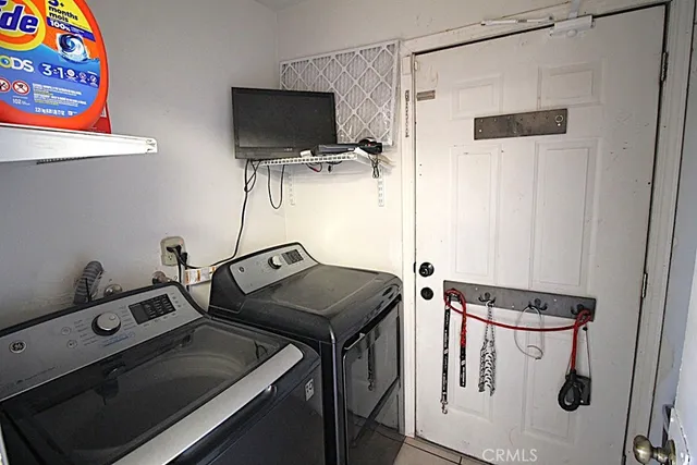 a kitchen with a stove a sink and a refrigerator