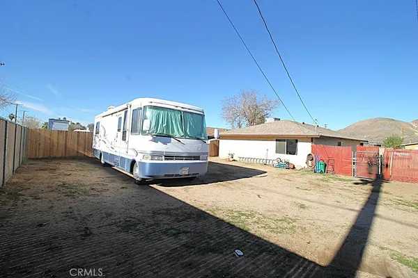 a view of a backyard of a house