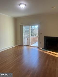 15 Fountayne Court Princeton, NJ 08540 - Photo 18 of 38 an empty room with wooden floor and fireplace