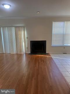 15 Fountayne Court Princeton, NJ 08540 - Photo 20 of 38 an empty room with windows fireplace and wooden floor