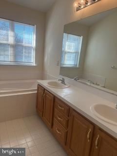 15 Fountayne Court Princeton, NJ 08540 - Photo 27 of 38 a bathroom with a sink a vanity and a bathtub