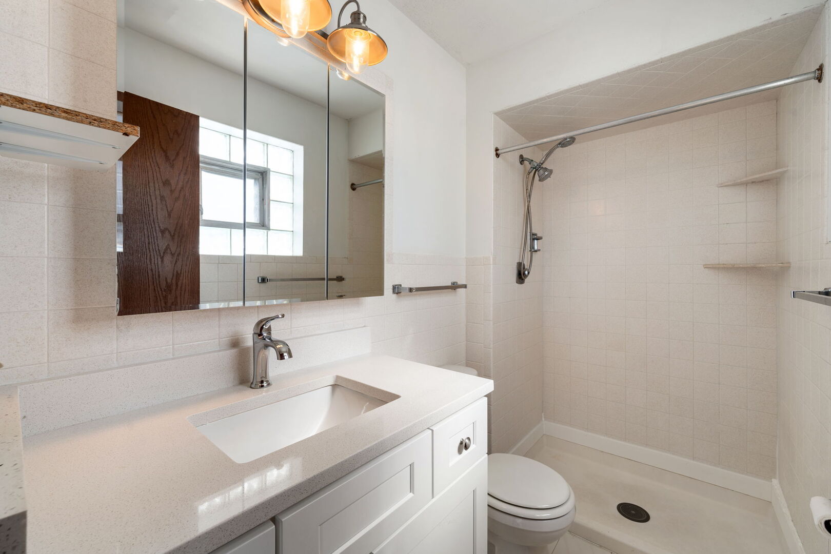 8427 West Windsor Avenue, Unit 1 Chicago, IL 60656 - Photo 14 of 34 a bathroom with a sink a toilet and shower