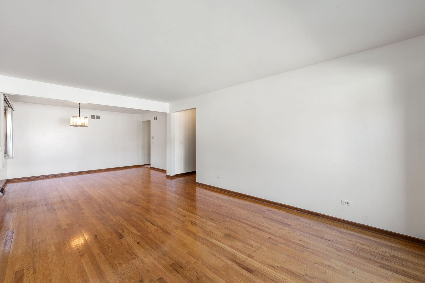 8427 West Windsor Avenue, Unit 1 Chicago, IL 60656 - Photo 5 of 34 a view of an empty room and wooden floor