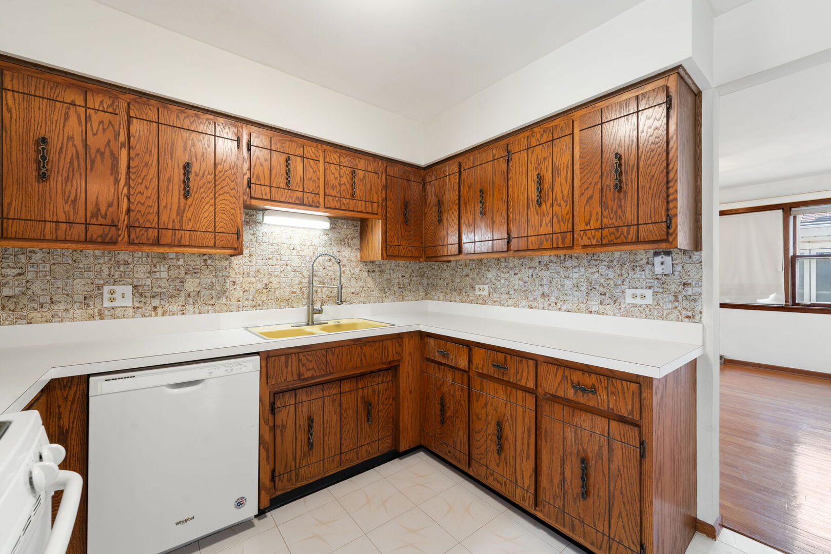 8427 West Windsor Avenue, Unit 1 Chicago, IL 60656 - Photo 7 of 34 a kitchen with a sink cabinets and window