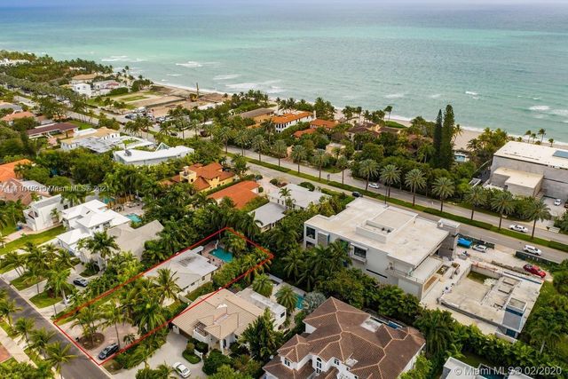 an aerial view of a city with ocean view