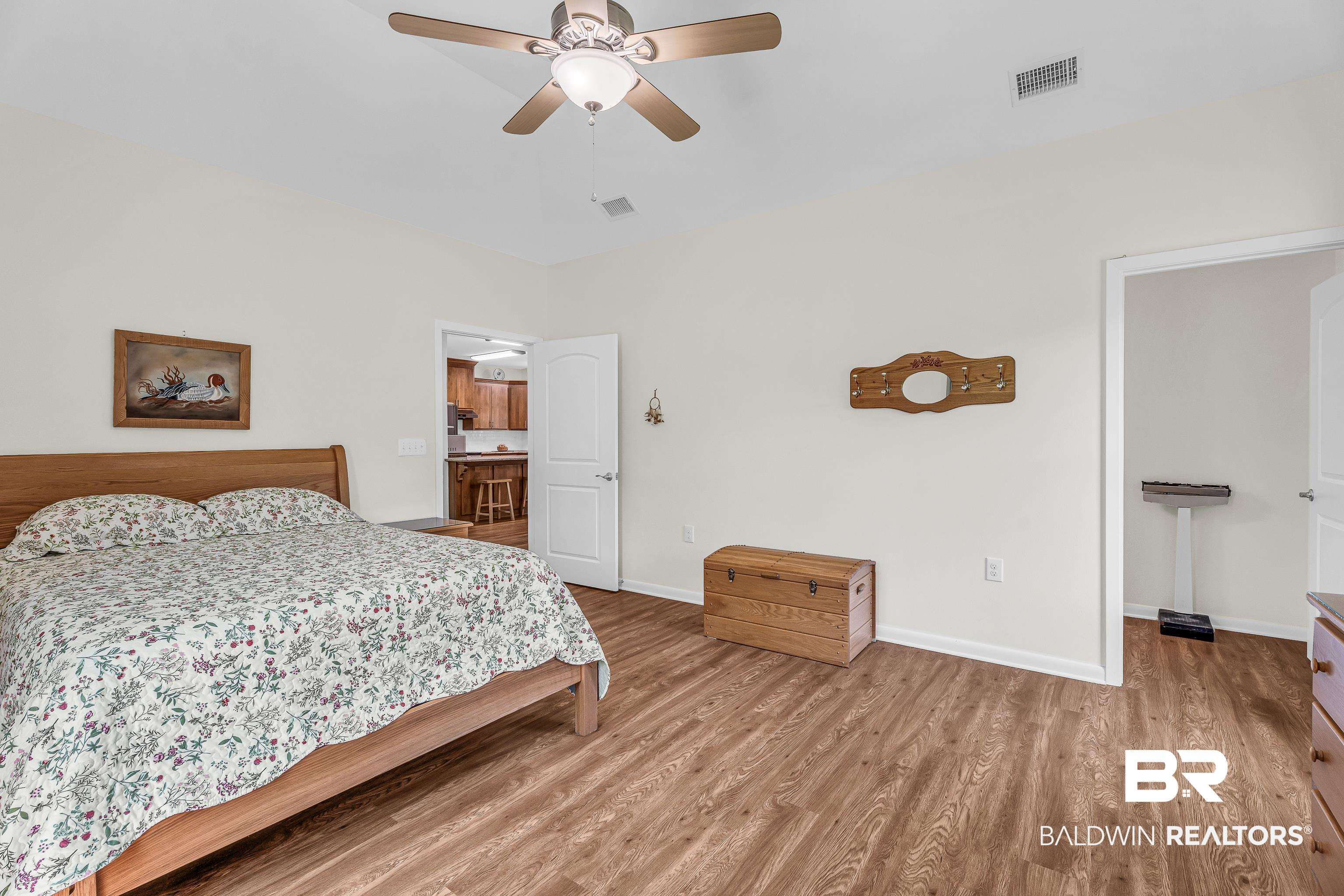 18255 Cactus Court Elberta, AL 36530 - Photo 24 of 53 Bedroom featuring light wood-type flooring and a ceiling fan