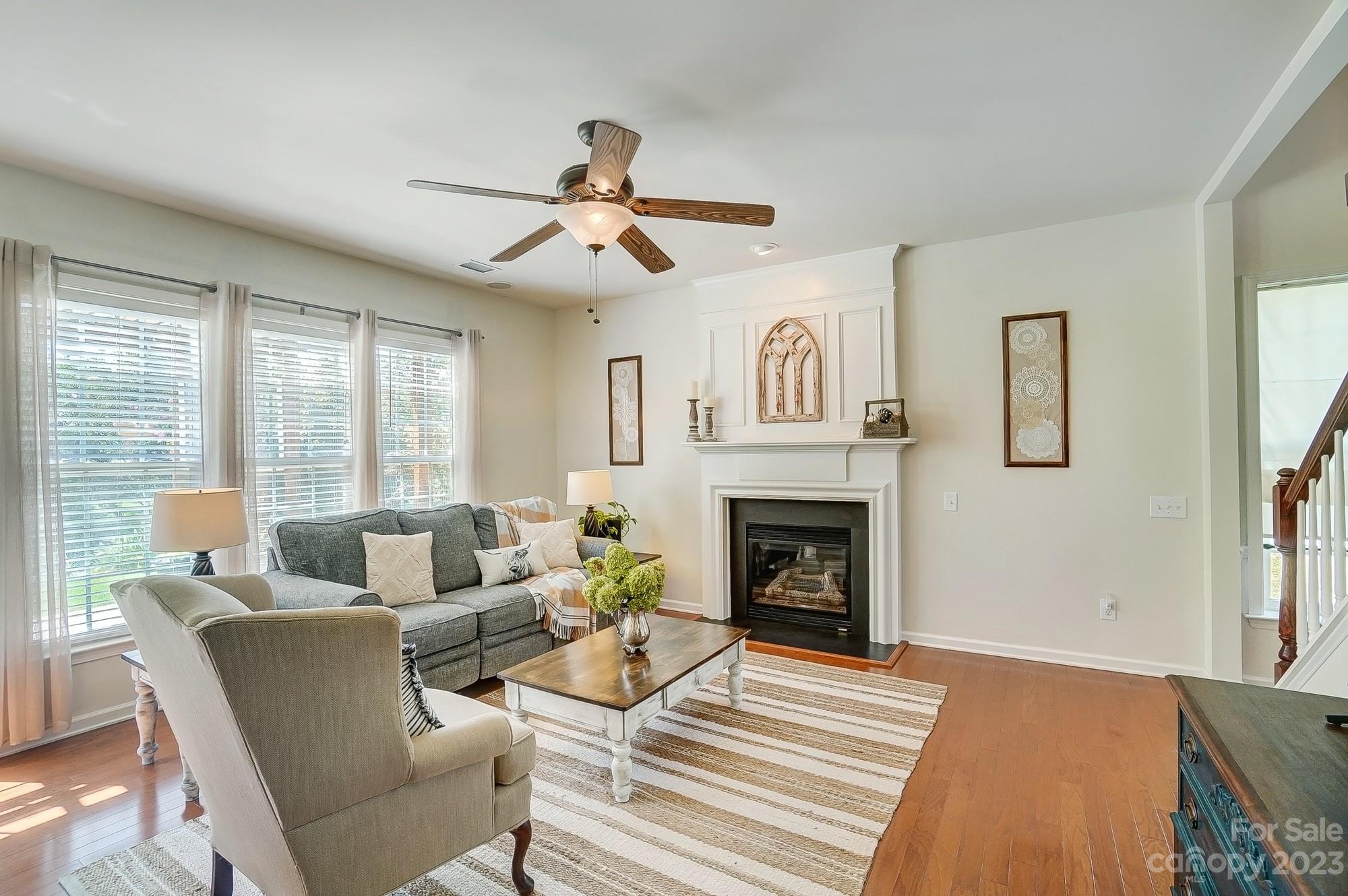 2512 Coltsgate Road Waxhaw, NC 28173 - Photo 5 of 48 a living room with furniture and a fireplace