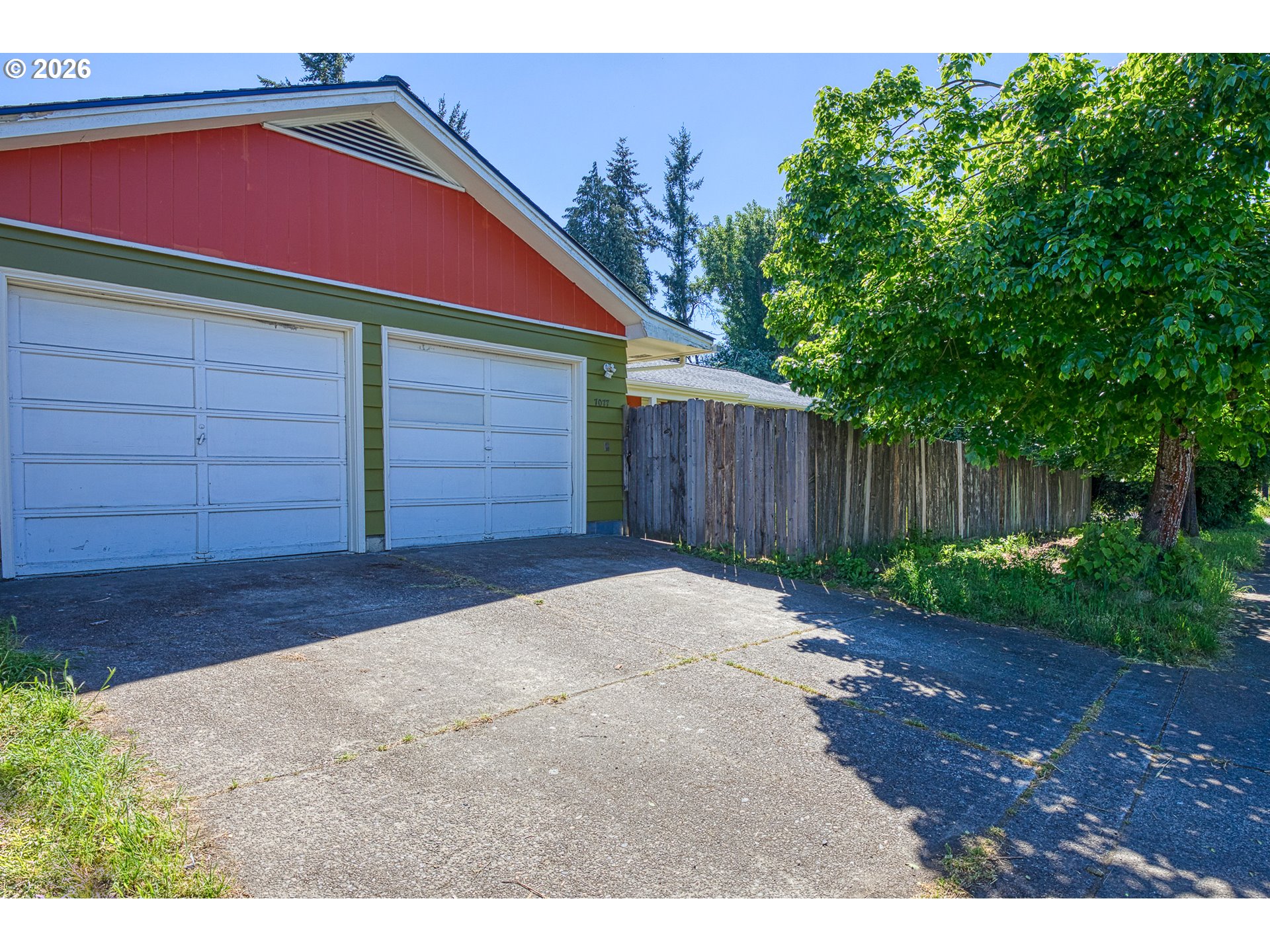 7077 Main Street Springfield, OR 97478 - Photo 29 of 34 a front view of a house with a yard