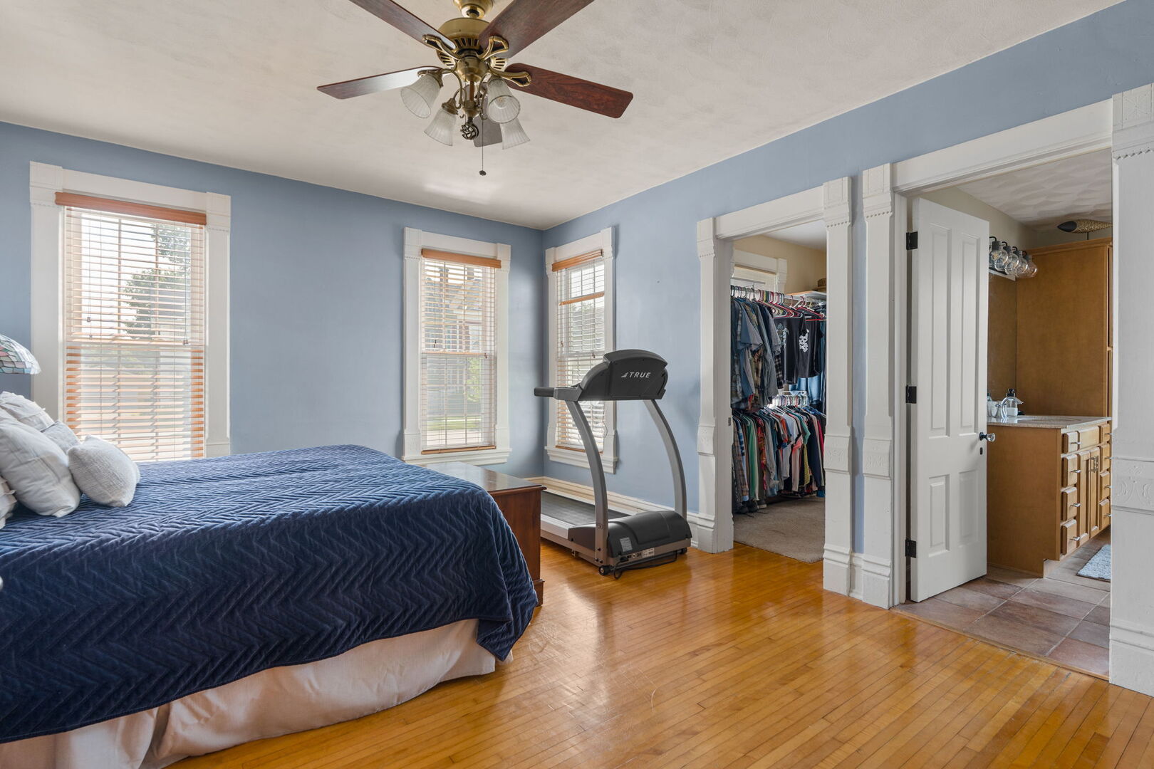 417 North State Street Geneseo, IL 61254 - Photo 17 of 51 a bedroom with a bed and a chandelier