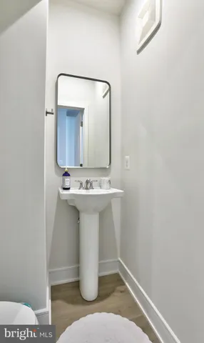 a bathroom with a sink and mirror