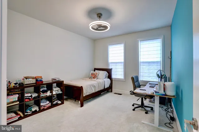 a bedroom with bed and a window