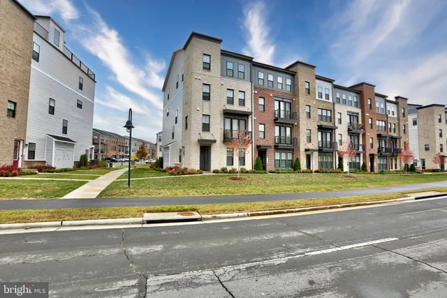 a view of a large building next to a yard
