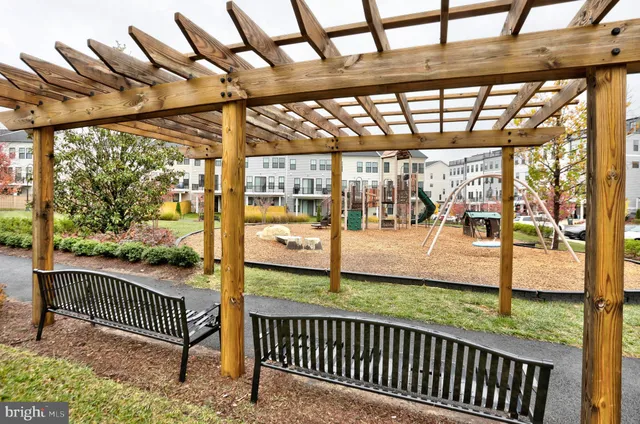 a view of a porch with a floor to ceiling window and wooden floor