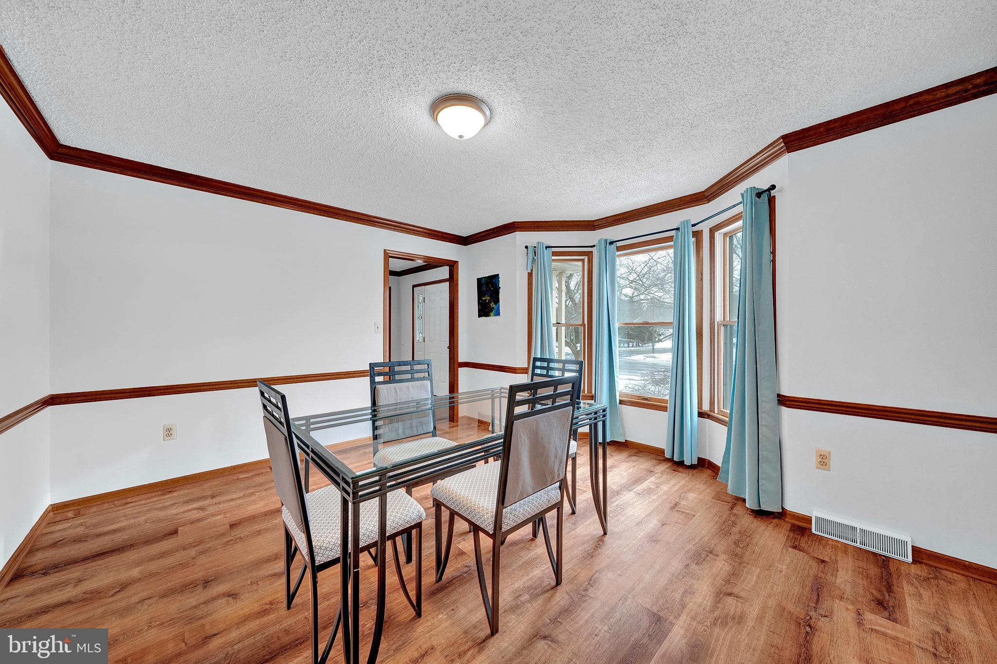 115 Robin Drive Hamilton, NJ 08619 - Photo 9 of 56 Formal dining room with bay window