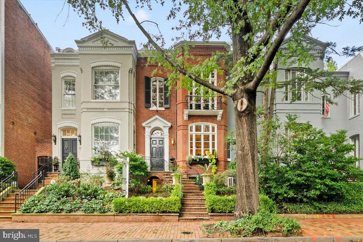 front view of a house with a garden