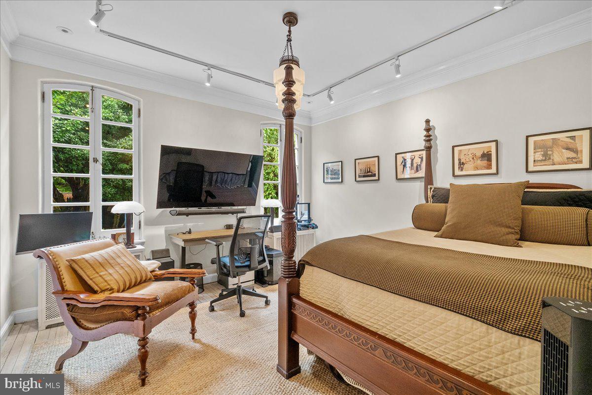 2815 Q Street Northwest Washington, DC 20007 - Photo 17 of 30 a bedroom with a bed and a flat screen tv