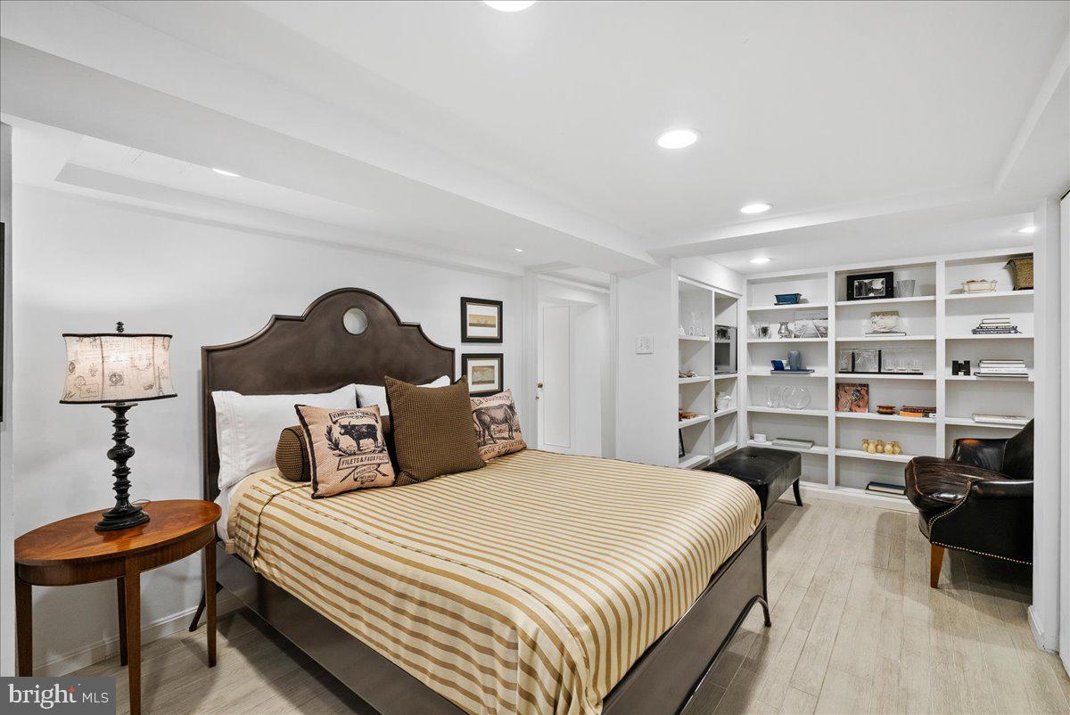 2815 Q Street Northwest Washington, DC 20007 - Photo 22 of 30 a bedroom with a bed and a book shelf