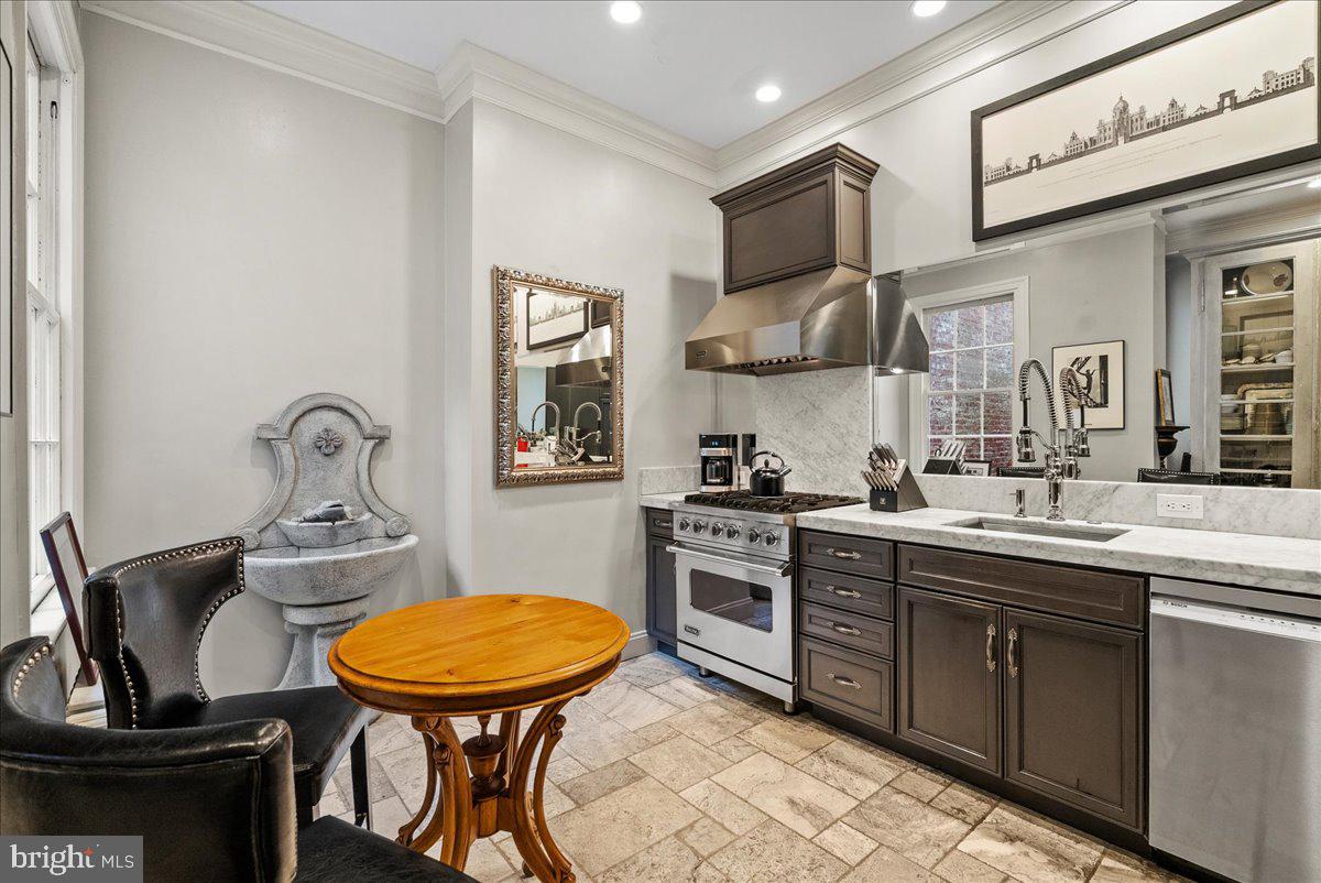 2815 Q Street Northwest Washington, DC 20007 - Photo 8 of 30 a kitchen with stainless steel appliances a sink and a stove